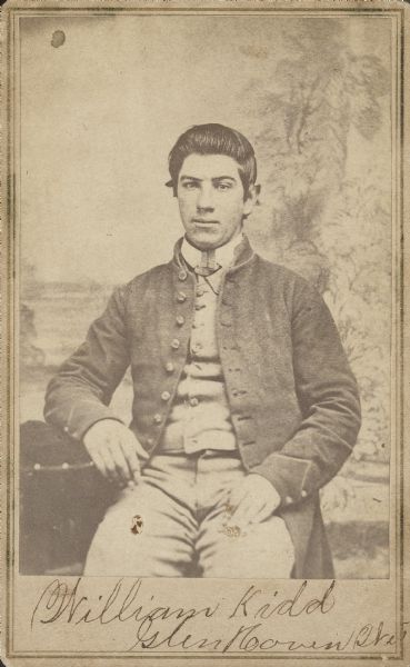 Seated carte-de-visite portrait of William Kidd, Company D, 42nd Wisconsin Infantry, in his uniform.