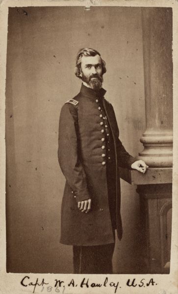 Three-quarter length carte-de-visite portrait of Captain William A. Hawley standing near a column.