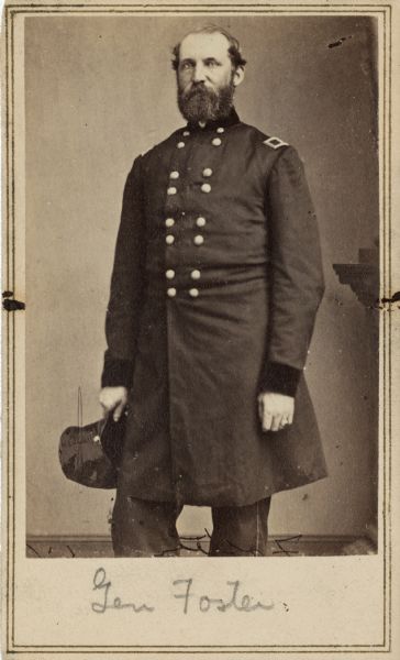 Three-quarter length carte-de-visite portrait of Major General John G. Foster in uniform, holding his hat. At the start of the war he was the chief engineer of the fortifications of Charleston Harbor, and was a leading participant in the bombardment of Fort Sumter. He later took part in General Burnside's North Carolina expedition, and commanded the Department of North Carolina, the Department of Ohio, the Department of the South, and the Department of Florida respectively.