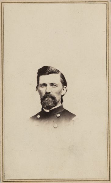 Vignetted carte-de-visite portrait of Brigadier General Samuel Harriman, 13th Wisconsin Volunteers. The 13th Wisconsin was organized during the spring of 1864 in Madison, Wisconsin under the supervision of then-Colonel Harriman. The regiment first saw action at the Siege of Petersburg, where the unit received heavy casualties. In April 1865, following the successful capture of Fort Sedgwick, Harrison was given a brevet promotion to Brigadier General for his action since Petersburg.