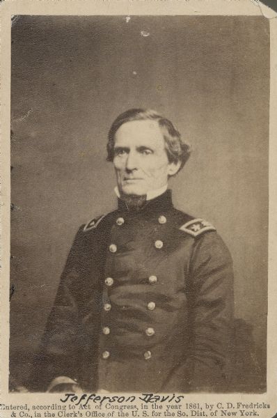 Three-quarter length portrait of Jefferson Davis, president of the Confederate States of America, in Union uniform.