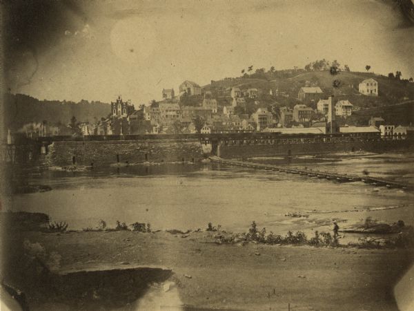 View of Harper's Ferry, showing the pontoon bridge and bridge (extreme left) which was destroyed in 1861.