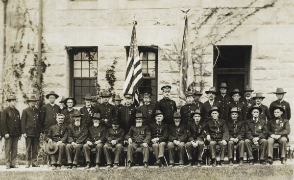 Group portrait outdoors of a group of Civil War veterans with other U.S. military officers.