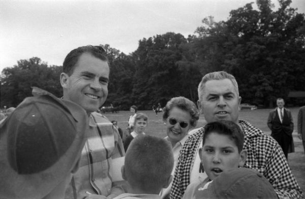 A Presidential Autograph An unidentified and undated photograph of Richard Nixon probably made early during his career. The photograph was taken by Washington, D.C. reporter Merriman Smith. The image is part of a roll that shows Nixon with a very small group, young children enjoying amusement rides, and a baseball diamond. It is possible that Nixon's daughters are among the children. Although Nixon signed some autographs, it is unlikely that a political event was taking place.