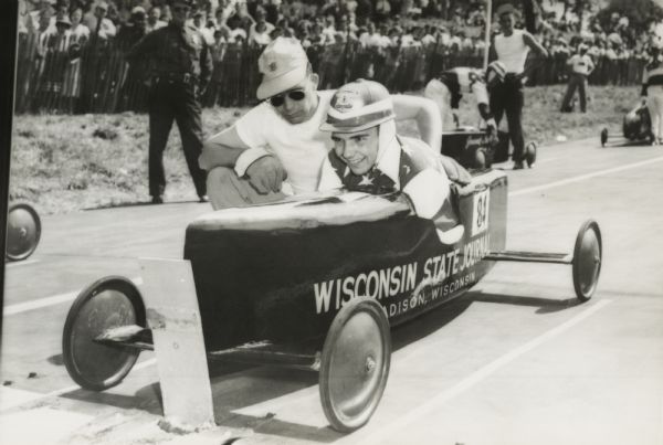 Madison, Wisconsin Champion Roddy Botts with a volunteer at the starting line of the All-American Soap Box Derby at Derby Downs.