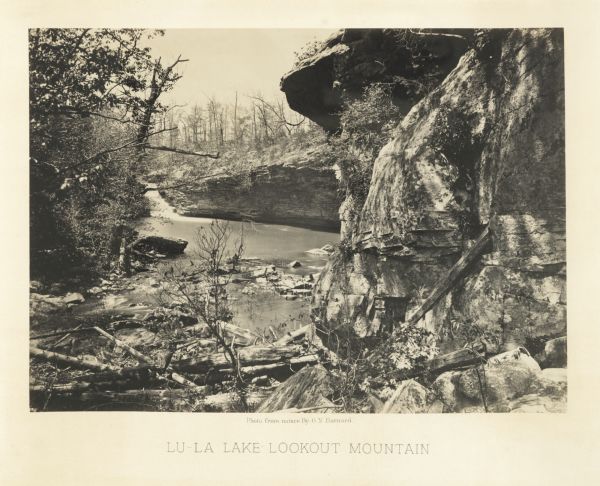 Cliffs along Lu-la Lake. A waterfall is in the background.<br>Plate 15</br>