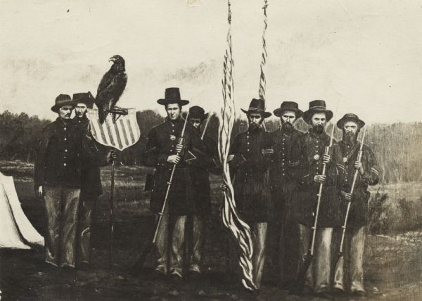 Photograph of a monochrome painting of "Old Abe" the bald eagle mascot of the Eighth Regiment, Wisconsin Volunteer Infantry, and his regiment color guard. The uniformed group stands holding rifles and flags in a field bordered with woods. A pup-tent is at lower left. Likely, Edward Homaston of Eau Claire holding the perch. Sgt. Ambrose Armitage third from left.