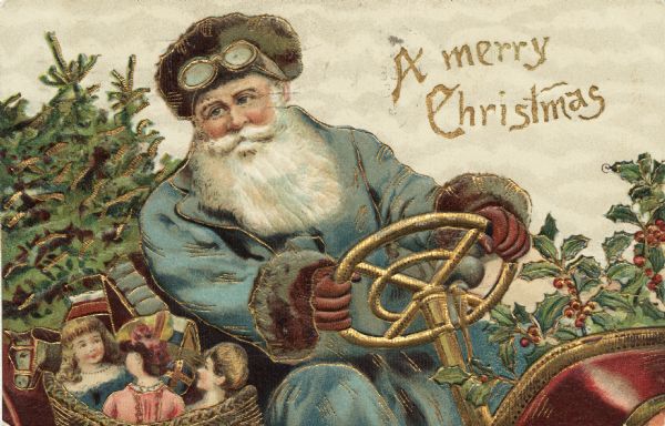 Holiday postcard showing Santa Claus behind the steering wheel of his motorized sleigh. Holly fills the front and pine boughs fill the back. He is wearing a driving hat and goggles. His coat is light blue and his gloves are brown. He has a basket full of toys next to him. Chromolithograph. Entire image is embossed.
