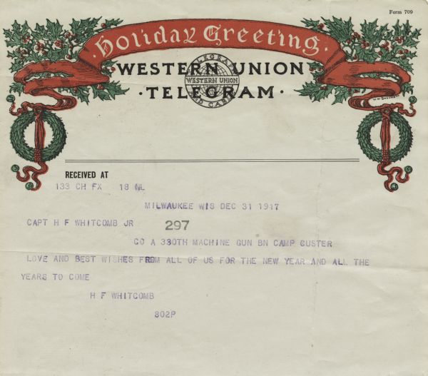 Holiday telegram from Western Union Telegram and Cable. The telegram form has a holiday theme. At the top is a banner with the text "Holiday Greeting" and wreaths and holly on each side. The message is "Love and best wishes from all of us for the New Year and all the years to come." Letterpress.