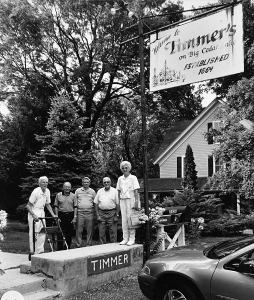 "Timmer's is on the southeast shore of Big Cedar Lake in Washington County. In the past it served as a hotel dating back to 1864." From left to right; Ralph Widmer, Rudy Heinecke, Ralph "Buddy" Ruecker, John Bodden, and Shirley Widmer.