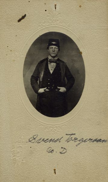 Three-quarter length oval studio portrait of Svend Torgerson, a private in Company D, 15th Wisconsin Infantry. The following information was obtained from the Regimental and Descriptive Rolls, Volume 20: He resided in Oconomowoc, Wisconsin. On November 11, 1864, he enlisted at Oconomowoc, Wisconsin and was mustered into service in Madison, Wisconsin on December 8, 1861, at the age of 19. He fought at Stone River, Tennessee and went missing in action until he rejoined Company D on January 11, 1863. Later, he served as a guard with a supply train going to Stevenson, Alabama. He was mustered out with Company D on February 13, 1865, at Chattanooga, Tennessee.