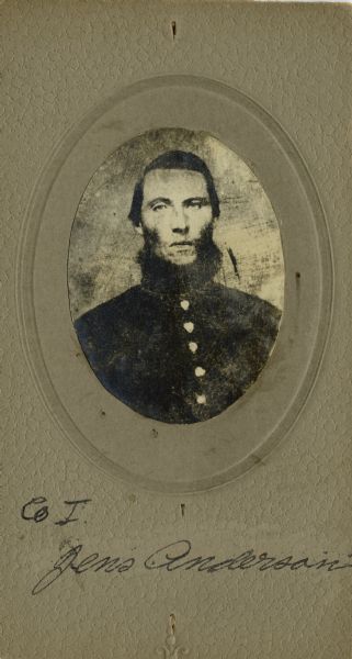 Head and shoulders oval portrait of Jens Anderson, a private in Company I, Wisconsin 15 Infantry. The following information was obtained from the Regimental and Descriptive Rolls, Volume 20: He held residence in Chippewa, Wisconsin. On December 14, 1861, he enlisted and was mustered into service on February 12, 1861, in Madison, Wisconsin at the age of 18. He survived the war and was mustered out of service on February 10, 1865, at Chattanooga, Tennessee.