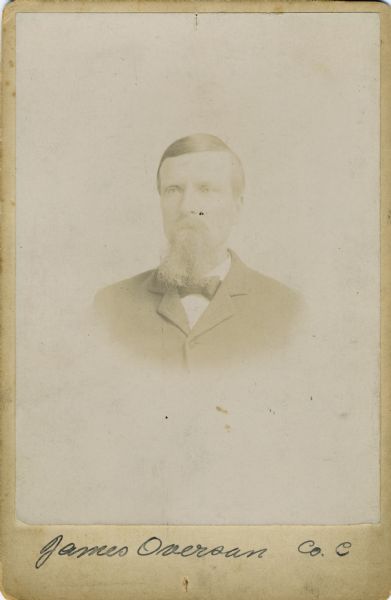 Vignetted quarter-length cabinet card portrait of James Overson, a private in C Company, 15th Wisconsin Infantry. The following information was obtained from the Regimental and Descriptive Rolls, Volume 20: He resided in Norway, Wisconsin. On November 5, 1861, he enlisted at Waterford, Wisconsin and was mustered into service in Madison, Wisconsin on December 2, 1861, at the age of 23. He was severely wounded on September 19, 1863, during the battle of Chickamauga. He was discharged on August 09, 1864 in Madison, Wisconsin while being cared for at Harvey Hospital. On August 20, 1867 he received the brevetted rank of captain in "recognition of distinguished gallantry displayed by him at the battle of Chickamauga, Georgia where his Company, being hard pressed and his captain having fallen, he took position in front and encouraged his comrades to maintain their position in the fight."
