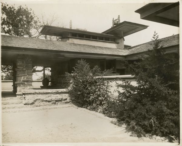 Entrance loggia and kitchen windows from the courtyard near the porte-cochere of Taliesin II.