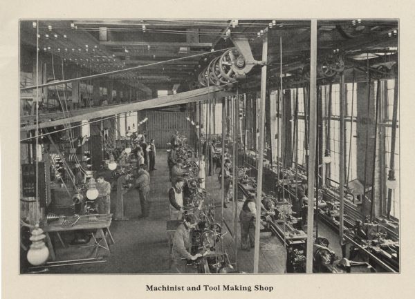 Elevated view of men working in the machinist and tool making shop at the Milwaukee School of Trades.