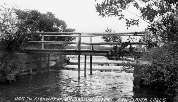 Rustic wooden dam and bridge between two of the Eau Claire Lakes in southwest Bayfield County.
