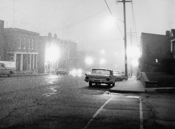 "Fog blanketed the town on a summer evening."