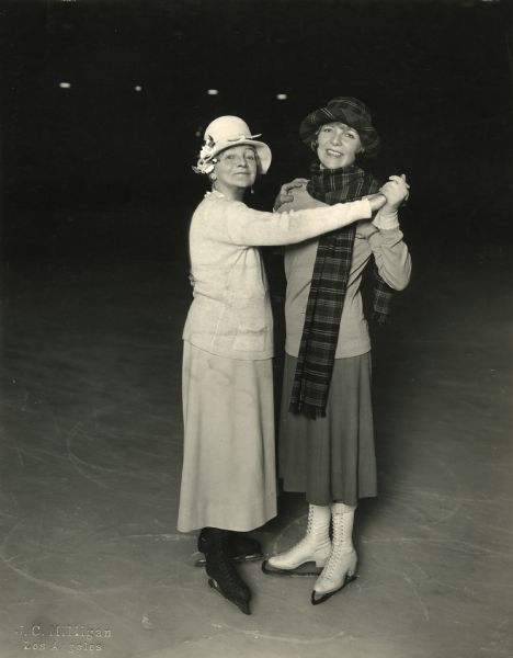 Silent film star Blanche Sweet and her maternal grandmother Mrs. Cora Blanche Ogden Alexander wearing ice skates.