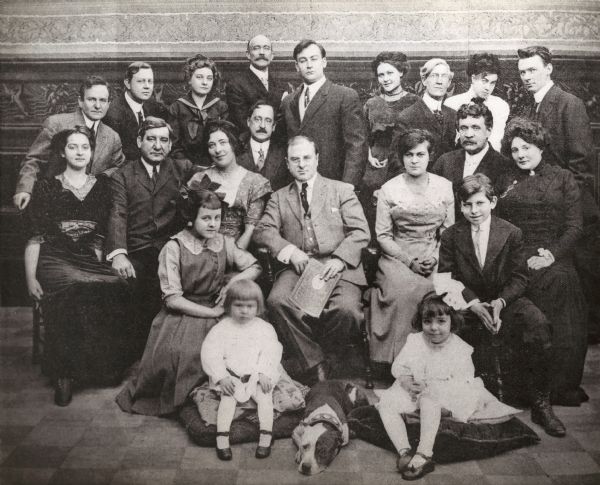 Group portrait of the Essanay Eastern Stock Company in Chicago, Illinois, 1911:
Top row, left to right: Joseph Dailey, F. Doolittle, Inez Callahan, William J. Murray, Curtis Cooksey, Helen Lowe, Howard Missimer, Miss Lavalliet, Cyril Raymond. Middle row: Florence Hoffman, Harry Cashman, Alice Donovan, Frank Dayton, Harry McRae Webster (producer/director), Lottie Briscoe (leads), William C. Walters, Rose Evans. Bottom row: Eva Prout (Evebelle Ross Prout), Bobbie Guhl, Jack Essanay (dog), Charlotte Vacher, Tommy Shirley (Thomas P. Shirley).