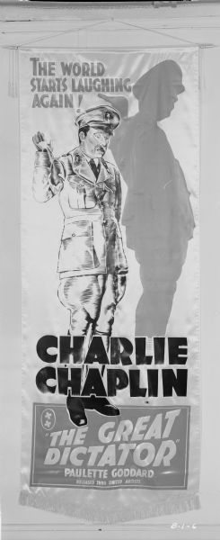 Banner design for "The Great Dictator." In this banner design for Charlie Chaplin's "The Great Dictator," Chaplin as Hynkel the dictator gives a salute and casts a large shadow.