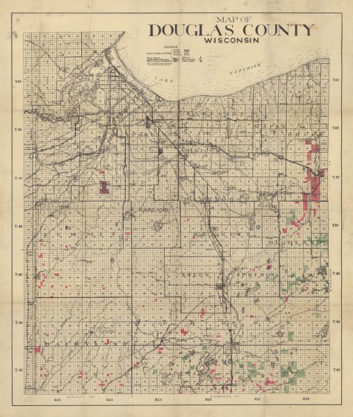 Shows county system of roads which are surfaced, well graded, common, or unimproved, town roads, state trunk highways, town and village boundaries, schools, rock outcrop, and county lands.  "Note: Large figures shown at principle points indicate elev. above sea level."