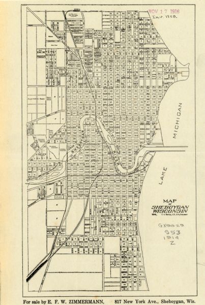 This map shows Sheboygan in 1914. The top of the map has the date of "NOV 17 1916" stamped in red ink. The map shows numbered plots and labeled streets, and also shows the Sheboygan River running through the middle of the town, and the shores of Lake Michigan. The bottom of the map reads: "For sale by E.F.W. Zimmermann, 817 New York Ave., Sheboygan, Wis."