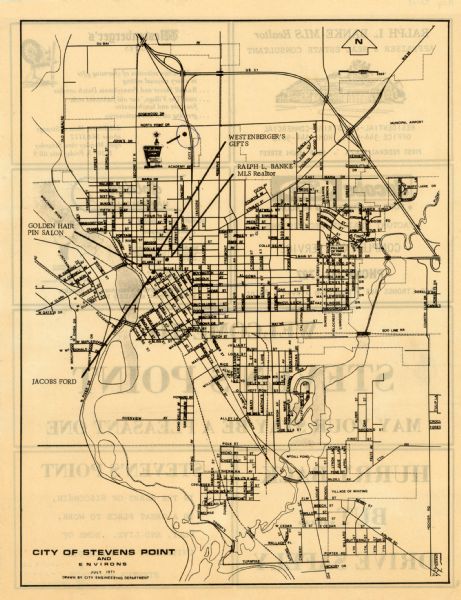 This map of Stevens Point shows labeled streets and selected points of interest: "Holiday Inn," "Westernberger's Gifts," "Ralph L. Banke MLS Realtor," "Golden Hair Pin Salon," and "Jacobs Ford." The back of the map features advertisements from all the business mentioned except Holiday Inn. The back of the map reads: "Welcome to Steven's Point may Your Stay Be A Pleasant One Hurray Back But......Drive Safely Steven's Point In The Heart of Wisconsin, is Great Place To Work, Play, And Live. Home Of University of Wisconsin Stevens Point."