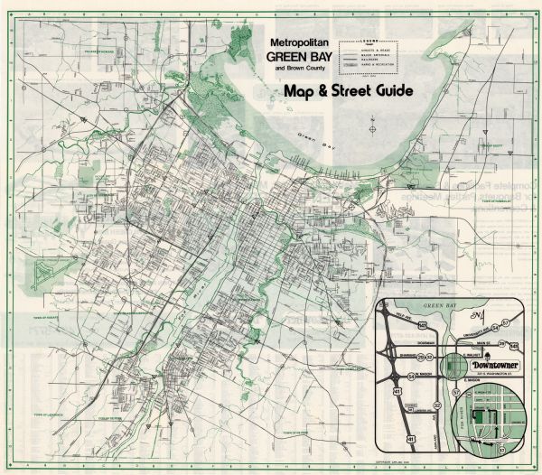 This map shows roads, highways, railroads, major arterials, towns, parks, recreational areas, and parts of Fox River and bay of Green Bay. The map includes inset map of Downtowner Motel vicinity and the location. The map is indexed by street name.
	