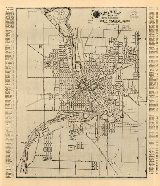 This map includes a street index and shows municipal golf course, parks, schools, cemeteries, Janesville County Club, and industrial sites. The back of the map features a photograph of the Janesville area.