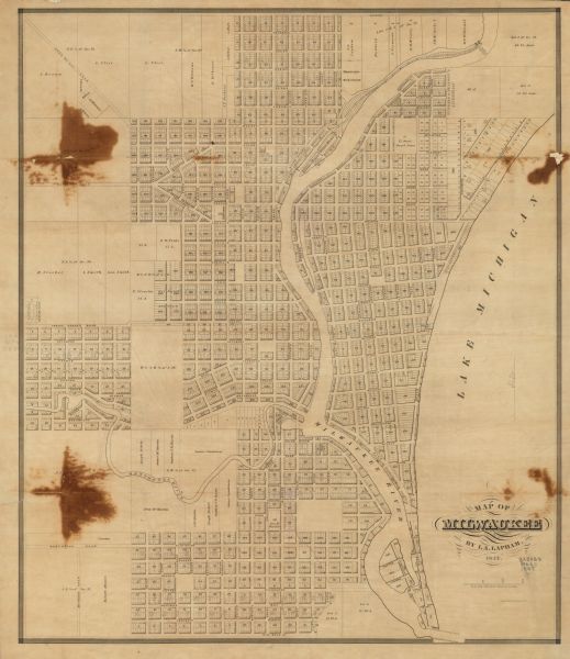 This map shows lot and block numbers, roads, railroads, and some landowners’ names. Lake Michigan, the Milwaukee River, and the Menomonee River are labeled.