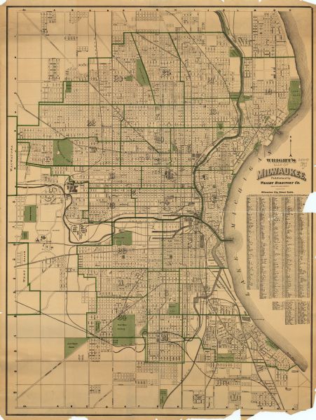 This map shows wards, streets, railroads, parks, cemeteries, select buildings, and Lake Michigan. Also included is a street index. Cemeteries and parks are illustrated in green.