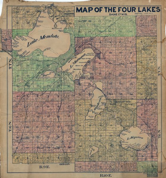 This hand-colored map shows landownership, rural dwellings, parks, roads, and railroads. Lake Mendota, Monona, Waubesa, and Kegonsa are labeled.