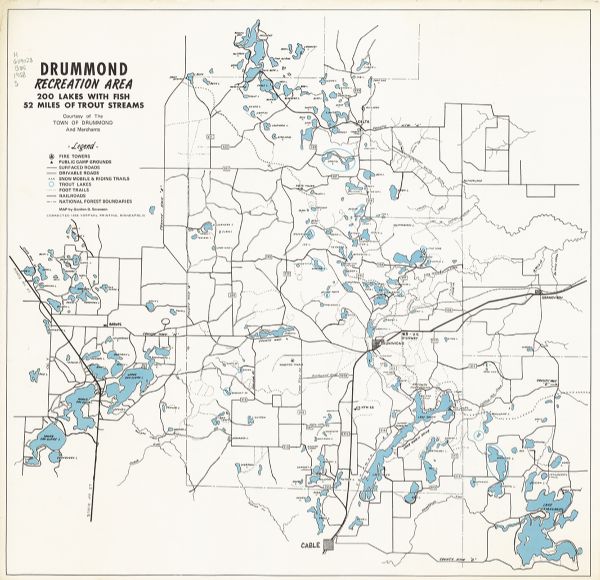 Drummond Recreation Area : 200 Lakes with Fish, 52 Miles of Trout Streams The map shows fire towers, public camp grounds, roads, snow mobile & riding trails, trout lakes, foot trails, railroads, and National Forest boundaries.