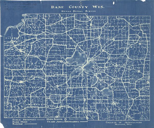 This Blue line print map shows trade area boundaries, lakes, farm homes, railways, high schools, public highways, and townships. A symbol key is included in the bottom margin.