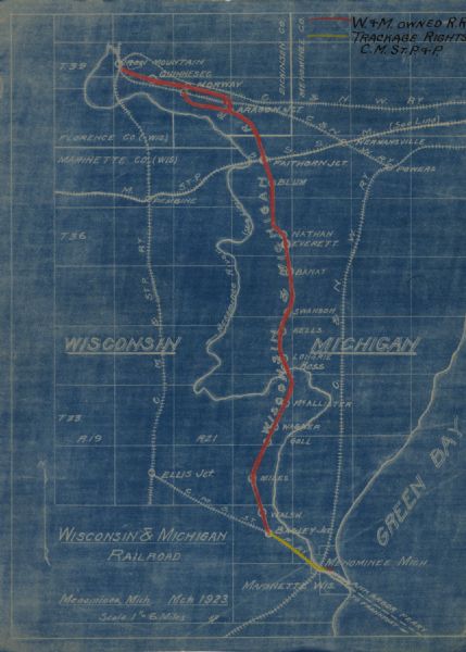 This blueprint map shows Wisconsin and Michigan-owned railroad and trackage rights from Iron Mountain to Menominee, Michigan, as well as other railroads. W & M railroad is indicated in red line, with trackage right to C.M ST. Railroad represented yellow. Cities and Green Bay are Labeled. Included is a portion of Michigan.