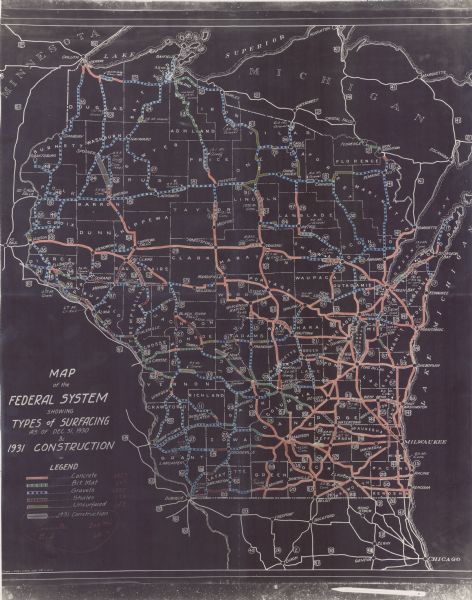 This map shows surface types on the highways including: concrete, bit, mat, gravels, shales, and unsurfaced. County boundaries, cities, rivers, roads, highways, and lakes are labeled. Lake Michigan is at the far right, with Lake Superior at the top. Included are portions of Minnesota, Upper Michigan Peninsula, and Illinois. 