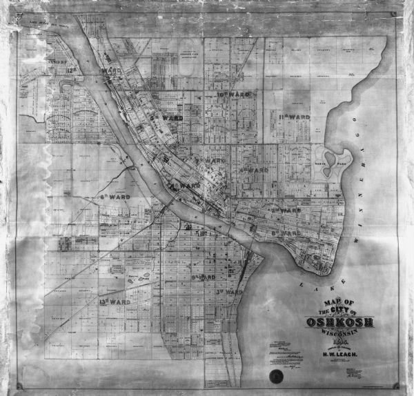 Map showing city wards, streets, block and lot numbers, additions, selected buildings, Lake Winnebago, the Fox River, and railroads as of 1895. The lower margin includes certifications.