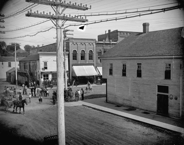Band Playing on First and Main Streets Elevated view looking down at an intersection towards a band playing at the intersection of First and Main Streets in Black River Falls.