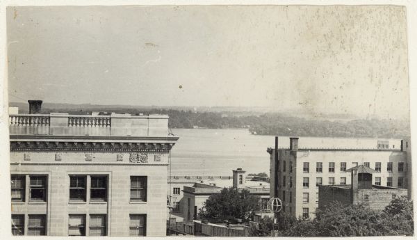 Elevated view to the south from the Capitol Square. The large building on the left is the original first National Bank that was demolished to make way for what is now Firstar Bank. On the right is the Beaver Insurance Building. In the center is the Post Office.