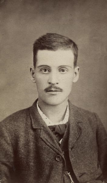 Jerome Francis Franklin, Sr. Formal quarter-length studio portrait of Jerome Francis Franklin, Sr. as a young man, about 30 years old. At this time he was married to Ettina Mae Perry Franklin and they had a family.