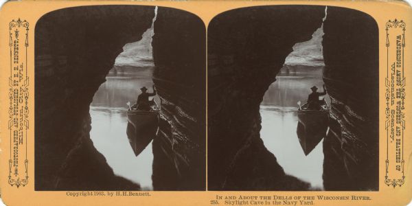 A silhouetted man on a boat in a cave. Text at right: "Wanderings Among the Wonders and Beauties of Wisconsin Scenery."