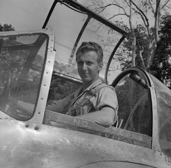 Major Arthur L. Post of Milwaukee, Wisconsin, was shot down on June 20th, 1943 and rescued on September 28th, 1943 after 101 days in the jungle. Here he is pictured in a similar plane to his unarmed photo plane, "Limping Lizzie," that was shot down. The airfield where this image was taken was located near Port Moresby, New Guinea (present day Papua New Guinea). Robert Doyle was not allowed to publish Post's story at that time. It was finally published in January, 1947, by the <i>Milwaukee Journal</i>. Major Post intended to write his own story, but was killed in a test airplane on August 25th, 1944, before he had the chance.