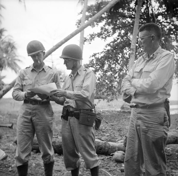 Three Generals of the 32nd Division, (left to right) Brigadier General Robert McBride, Brigadier General Clarence A. Martin and Major General William H. Gill. Trees are behind them.