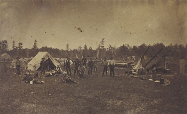 Railroad surveying party in camp somewhere north of Green Bay. The men were surveyors for the Chicago & Northwestern railroad extension.