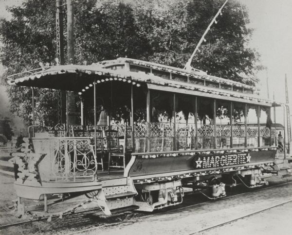 Special open streetcar called the <i>MARGUERITE</i>, with elaborate lighting, decorations, movable chairs and other features.

