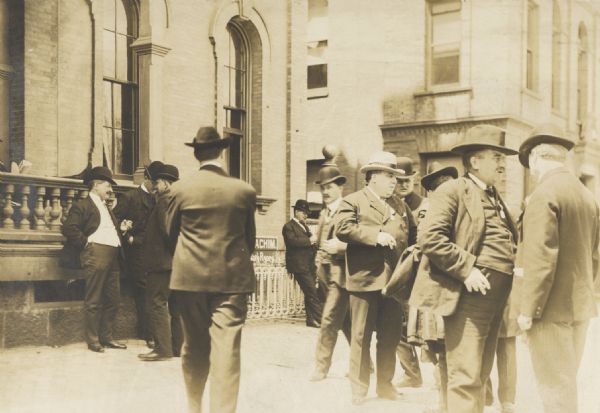 Street scene in front of the Park Hotel, on Main and Carroll Streets, showing “delegates going to the convention.”.