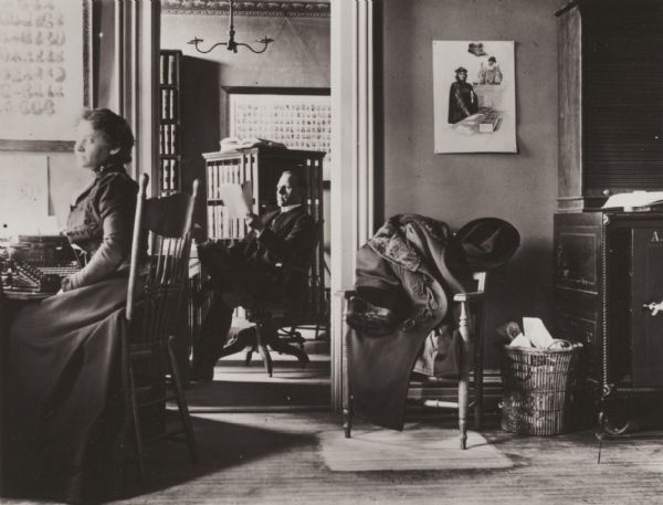 Two views of the interior of the La Follette, Harper, Roe & Zimmerman law office. Mr. Zimmerman is sitting in his inner office; the lady in the foreground is probably Jennie Nelson, his secretary.