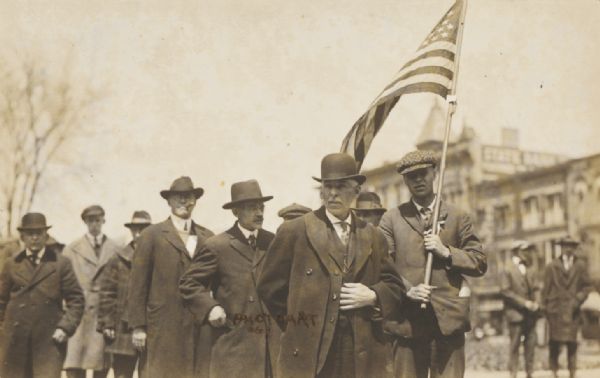Detail of a group of civilian men in the Loyalty Day parade.