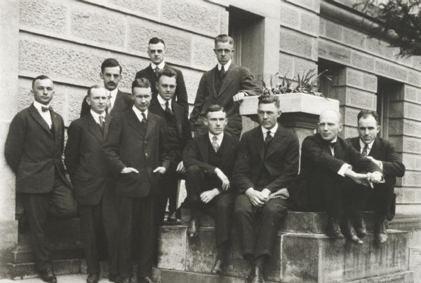 Posed group of University of Wisconsin students (?) on the steps of the Biology Building.
