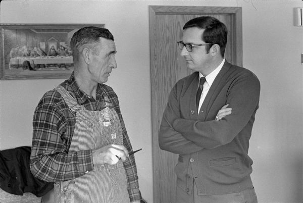 Photo shoot of David R. Obey (right) during his first campaign for Congress with farmer-State Legislator Laurence Day.